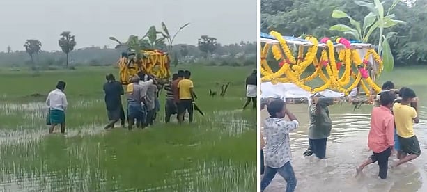 வயல்வெளி வழியே சுடுகாட்டிற்கு செல்லும் மக்கள்